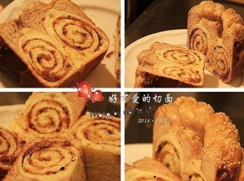 step10: 這次特意沿著《肉鬆捲麵糰》的擺放而下刀 刻意選擇能同時切到兩個《肉鬆捲麵糰》的方法 很豪邁地從中間將《愛心》由上、下一分為二 結果看到的切面上有著兩個超可愛的漩渦 一整個心情大好，忍不住驚叫了起來 連孩子都跟著大呼：『好可愛啊！』 《沙拉》的輔助再加上手指溫柔的按壓與滾動 即使我使用的只是很廉價的麵包刀 也沒讓《海苔肉鬆》因切割而鬆散開來 再以縱向將吐司切成兩半 結果就有了四等份的可愛蝸牛狀愛心吐司了 實在是一次帶來驚喜與滿滿成就的實作經驗 即便是上方精心策劃的《愛心》走了山 但包覆在整個吐司裡滿滿的愛相