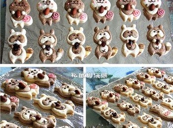 step12: 將《巧克力》放擠壓袋中，隔水加熱融化後
為《松鼠》和《浣熊》點綴上可愛的五官
森林裡可愛的小松鼠和小浣熊
就這麼活靈活現的成軍了‧‧‧



【同場加映】
我用壓模後邊緣剩下的麵糰
做出了萬聖節可怕的《巫婆手指餅乾》唷！