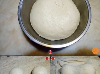 step9: 在鋪料事先炒好放涼備用的同時，麵糰也差不多已經完成發酵；自微波爐取出完成發酵的麵糰，基本上要漲大至發酵前的1-1.5倍大即可。完成基發酵後的麵糰分割成兩糰，壓扁排氣之後，再次收口滾圓，蓋上濕布再進行第二次發酵約15-20分鐘。