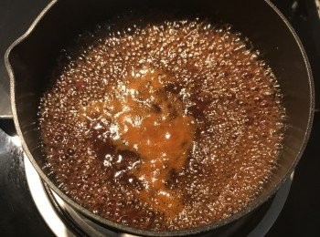 step18: 煮滾後關火，如買到的紅糟醬較粗，則可先用濾網過濾ㄧ下；