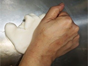 step11: 雪櫃取出咸水角，放在案板上揉搓至軟滑