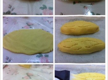 step2: 取出麵團平均分成4份，餡料也是一樣分4份加入適量的杏仁片。

取出其中一份麵團放在保鮮紙上，輕輕壓成橢圓形，餡料搓成長形放在麵團上，然後輕輕捲起來，兩邊用手壓扁，成封口。

調製表面裝飾，將蛋黃和淡奶混合，馬上可以預熱烤箱170度上下火。