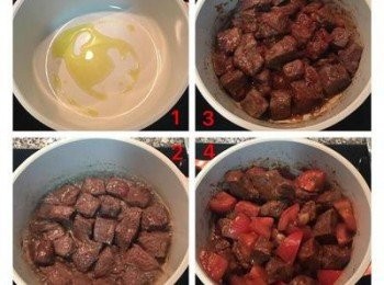 step3: 燉鍋中放適量橄欖油燒熱後，將牛肉煎到4面上色，將牛肉撥到鍋邊，中間空出來放入蒜頭，剖開面朝下略煎，再放入蕃茄糊略炒一下後，拌開,讓牛肉都沾到蕃茄糊， 接著放入蕃茄塊拌炒。