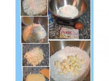 step3: 冷凍的奶油切小丁放入已加有糖和鹽的低粉中，用手慢慢將奶油捏扁，等捏的差不多時將蛋液倒入，用壓的方式讓其成糰（有些鬆散或奶油沒溶完全都沒關係）