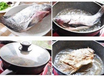 step2: 將吳郭魚洗淨後，兩面魚身用刀子各劃上數刀，塗抹少許鹽巴後再沾裹適量的地瓜粉，放入熱油中半煎半炸式料理，再適時的翻面；為了防止油濺蓋上鍋蓋就能保持安全喔~