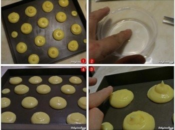 step6: 接著再將麵糊放入裝有圓珍擠花孔的擠花袋內，以大約相等的距離擠出大約2cm直徑的麵糊，接著再準備一小碗的水，用手指沾濕在麵糊上方輕壓一下