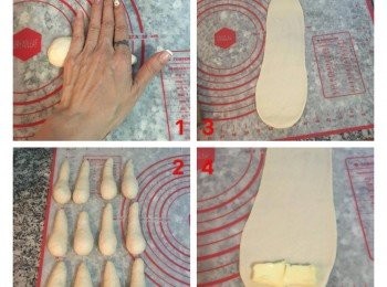 step7: 取一顆麵糰,用手掌壓在中間的地方,用一點點力將麵糰揉成水滴狀, 同樣的揉水滴狀時也是要依順序排好,先揉好的要先進行壓桿. 取一水滴麵糰, 桿麵棍從麵糰最厚的地方壓下,一手抓著水滴麵糰的細端,一手向前移動桿麵棍,然後再往回桿,讓麵糰的厚度一致.接著在麵皮最寬的地方放入4-5g有鹽奶油.